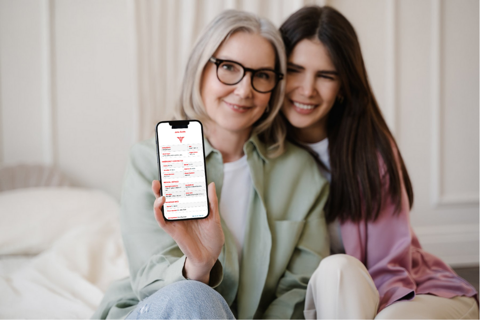 Woman and her daughter showcasing the medical profile on iPhone.